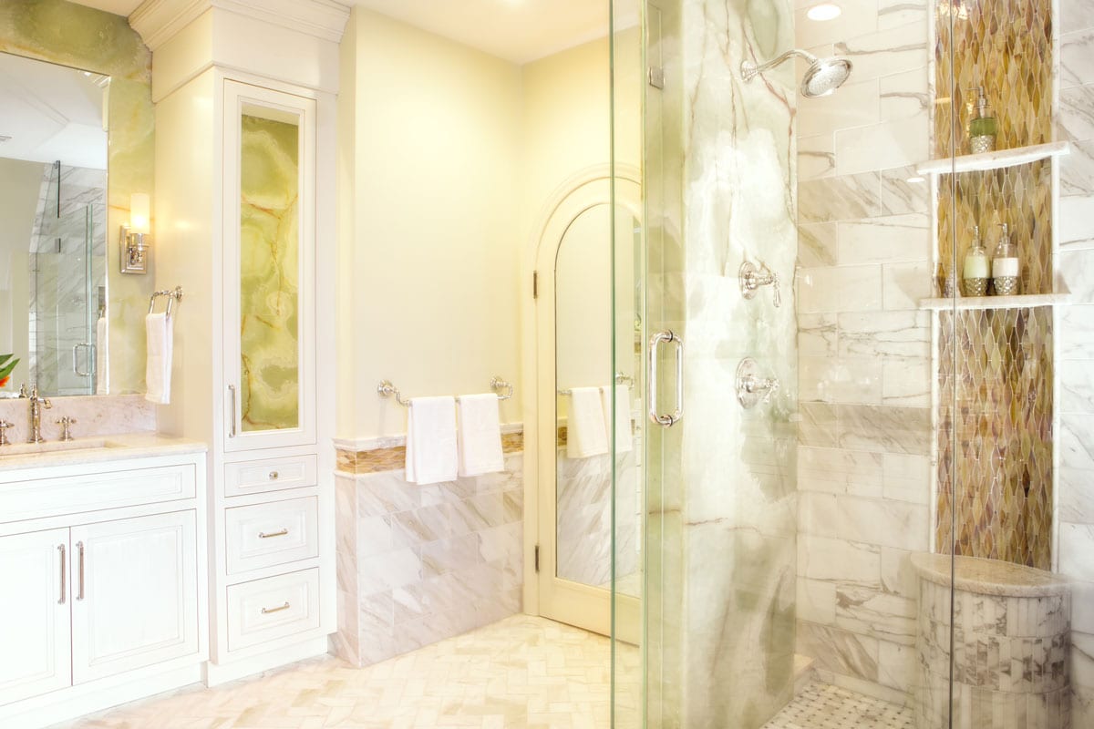 bathroom remodel white vanity, herringbone tile, shower