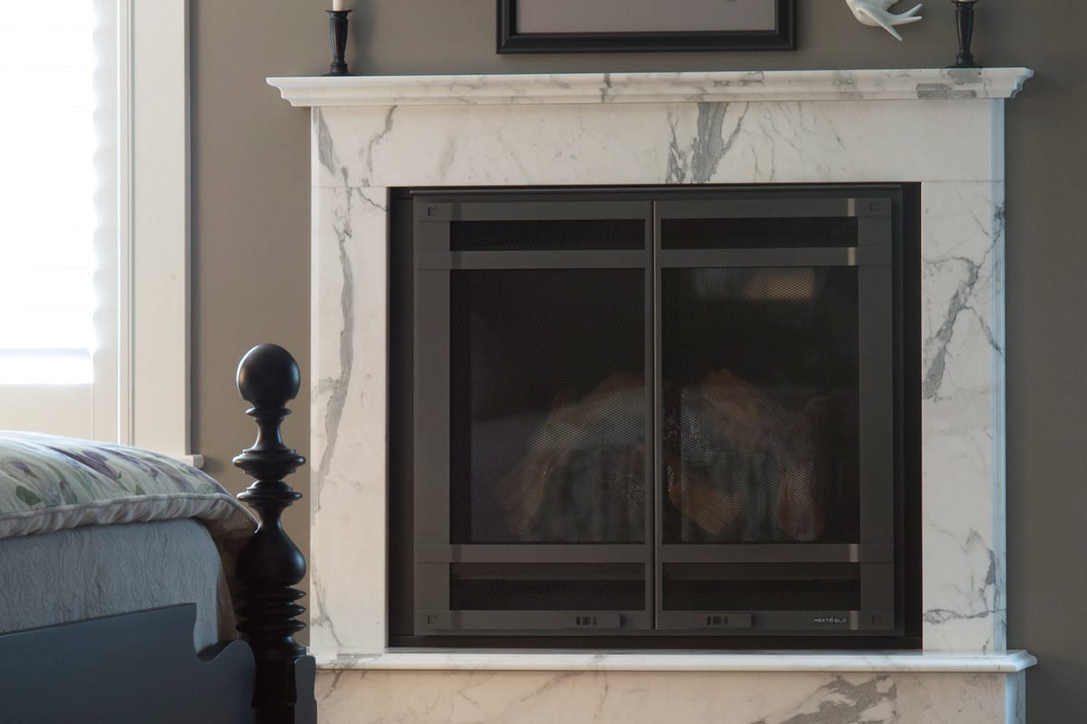 close up of a marble stone fireplace