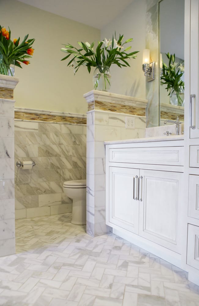 bathroom remodel white vanity, herringbone tile