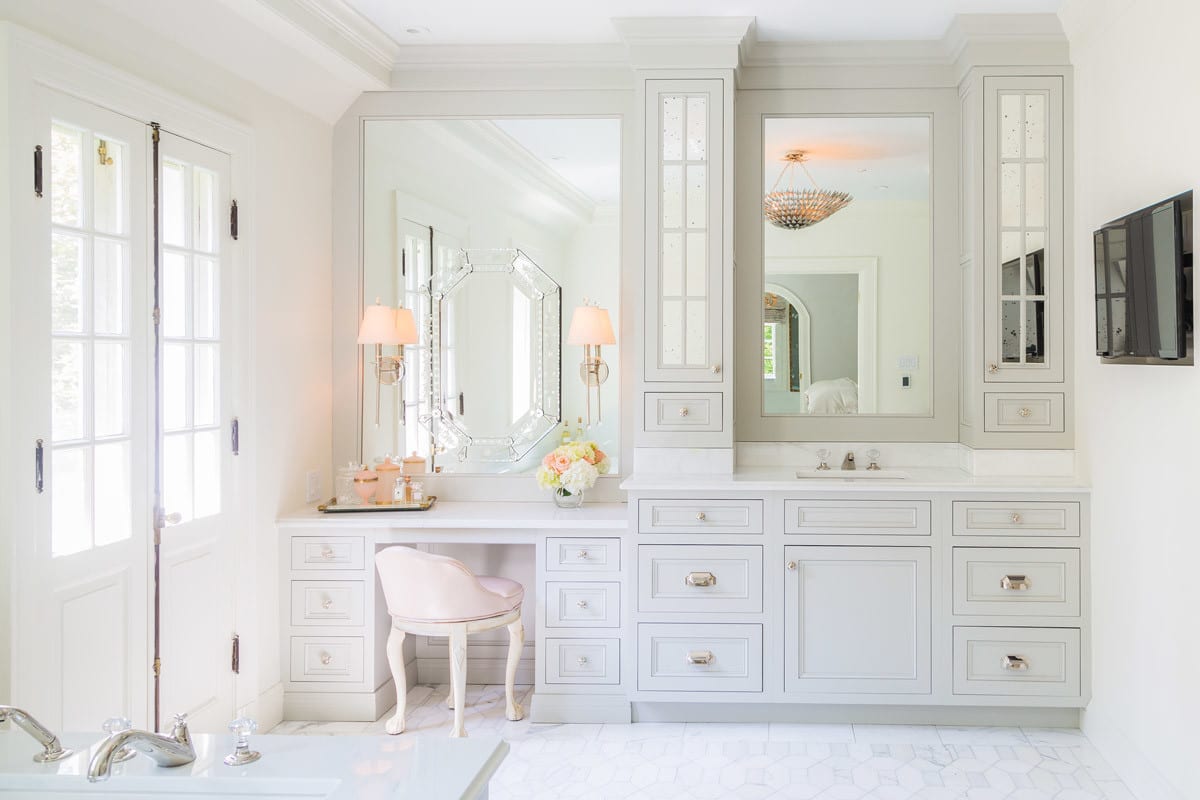 Large elegant bathroom remodel with soft gray cabinetry and marble flooring