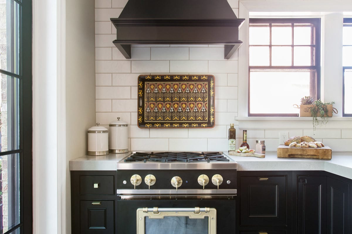 A Brentwood Missouri kitchen remodel with black cabinetry and white backsplash