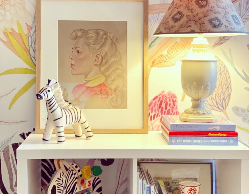 Watercolored jungle and animal scenes are a great way to complete the look of a child's bedroom along with a small bookshelf for toys and clothes.