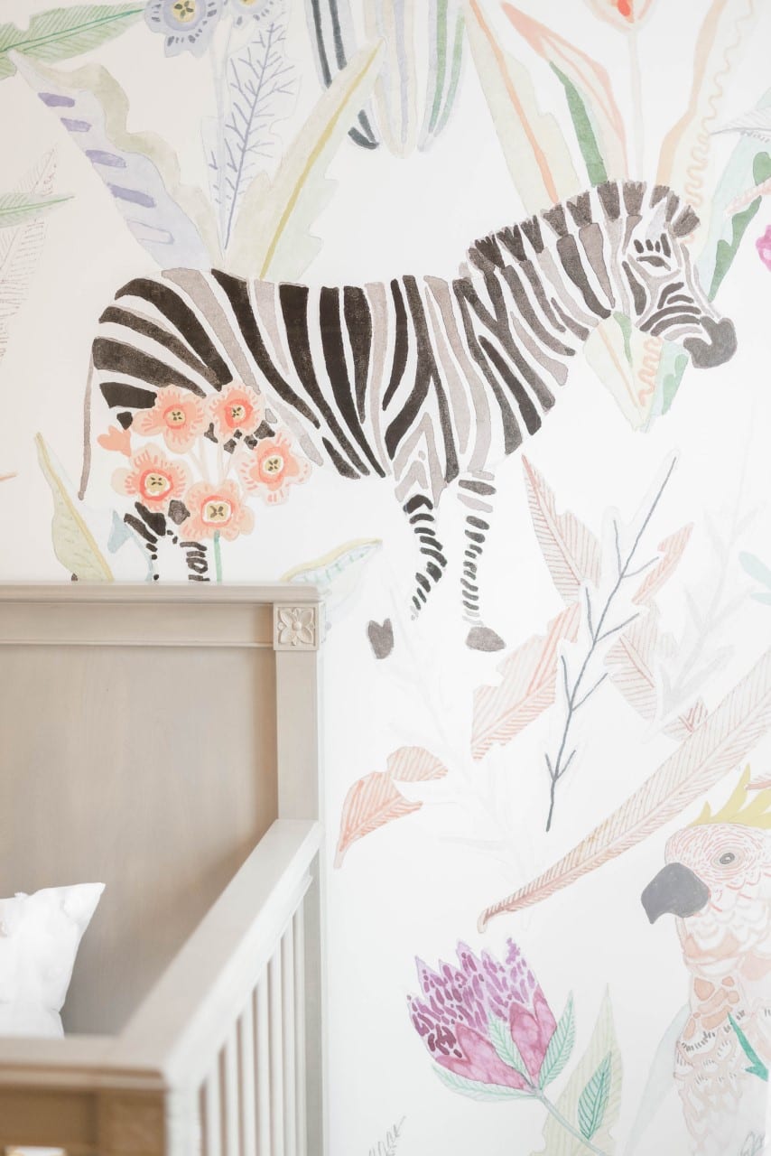 Watercolored jungle and animal scenes are a great way to complete the look of a child's bedroom.