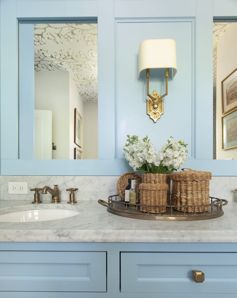 Beautiful blue bathroom cabinets with marble countertops