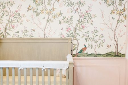 whimsical pastel nursery with floral wallpaper