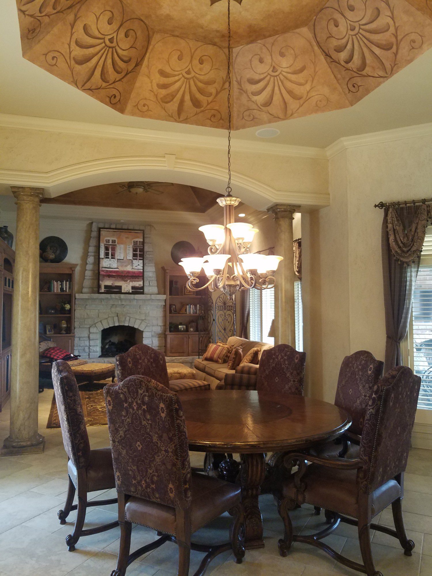 dining space with dark accents and tuscan wallpaper