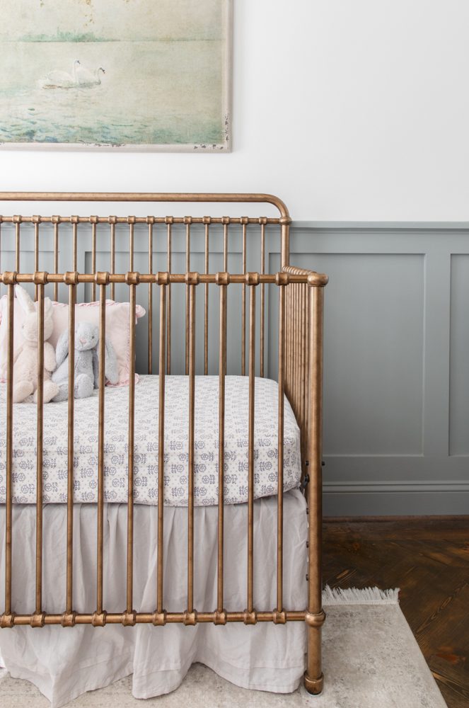 antique style brass crib in a gorgeous nursery