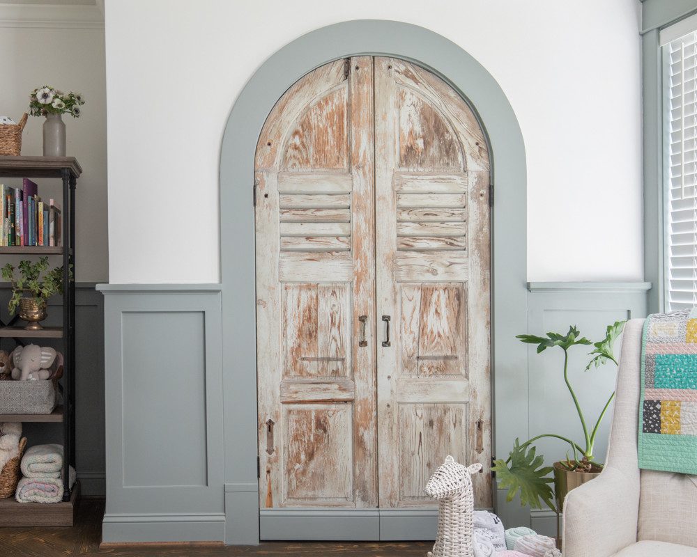 rustic arch doorway with grey blue trim