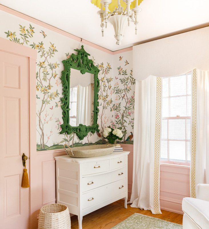 changing table in a nursery with pastel colors and floral accents