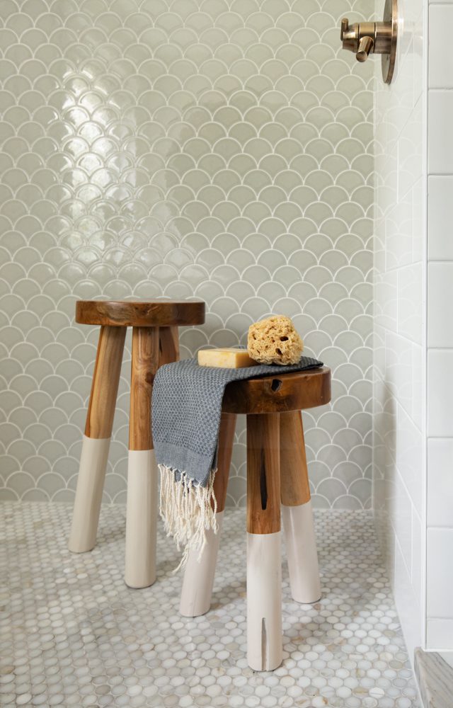 shower with scalloped grey and white tile