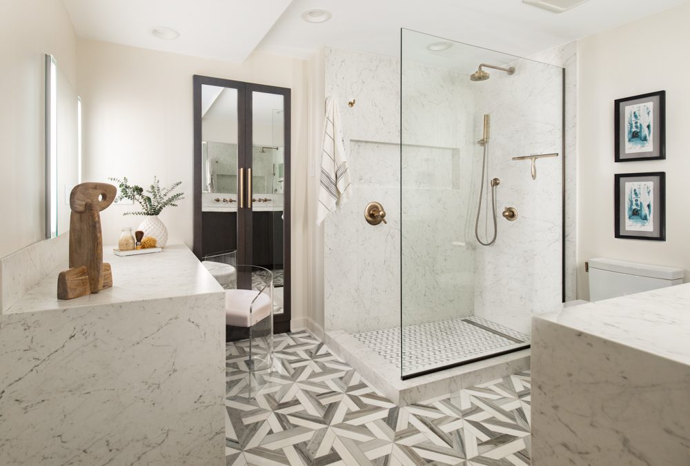 spacious modern kitchen with a large walk-in shower and geometric grey and white tile