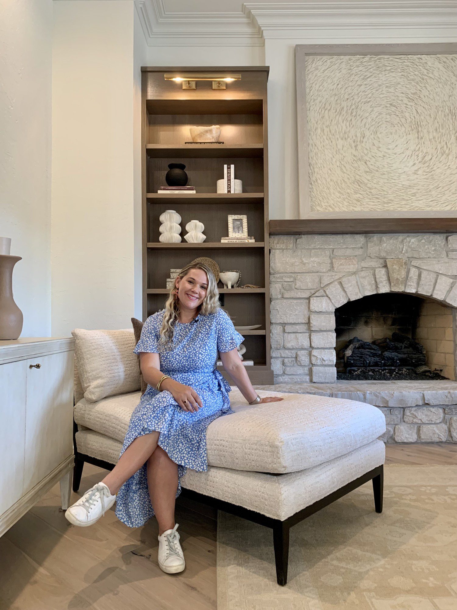 a smiling portrait of Ashley Obradovits posing in a Karr Bick designed living room