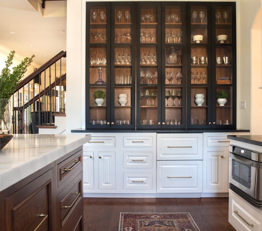 large built in-china cabinet with black cabinets in a spacious kitchen