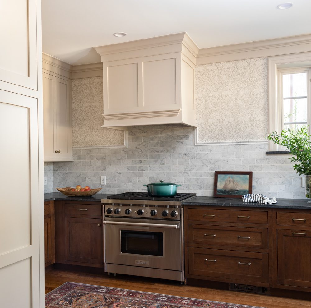 simplistic and spacious kitchen with cream trim and dark wooden cabinetry