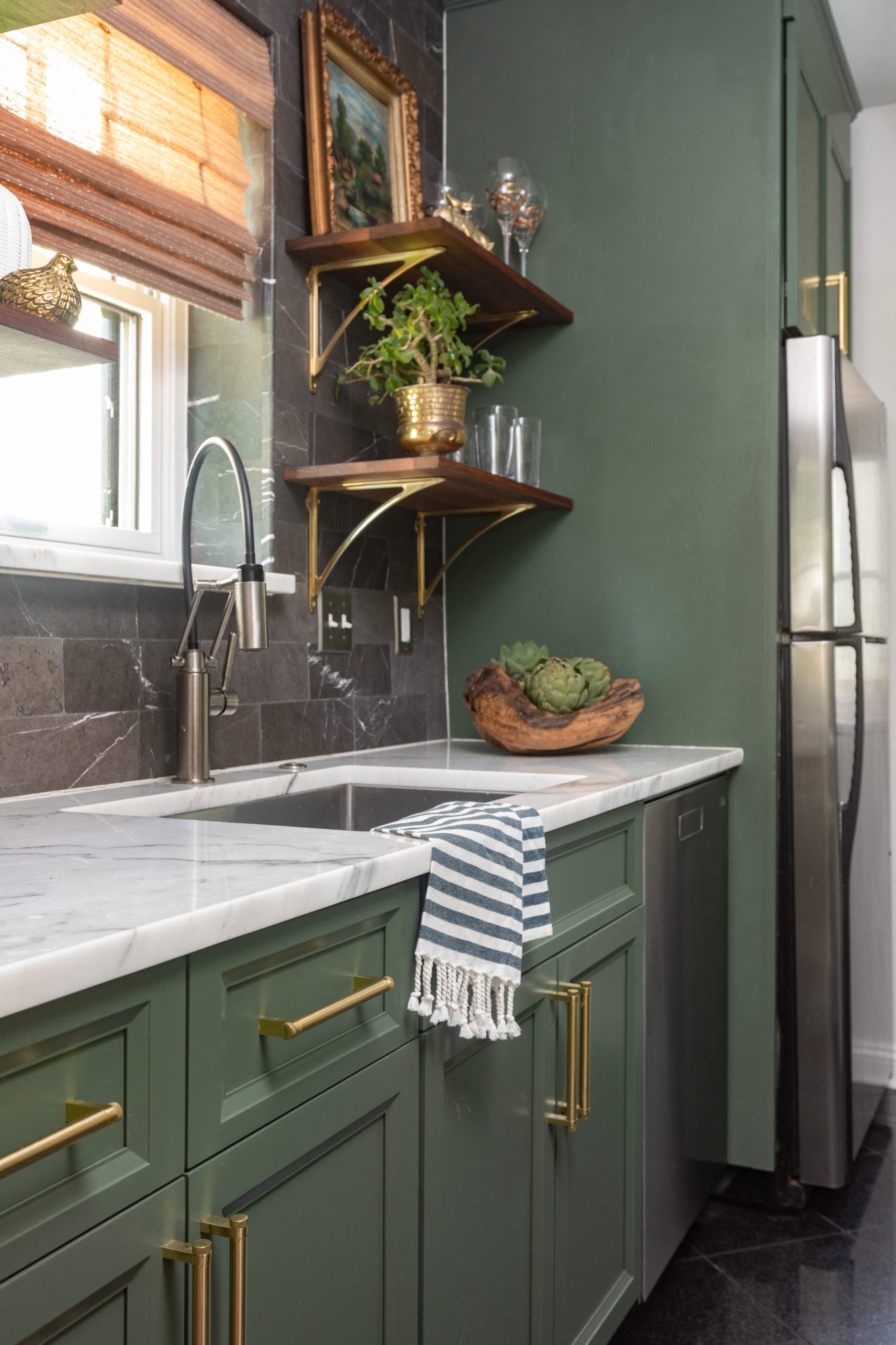 kitchen with green cabinetry and gold accents