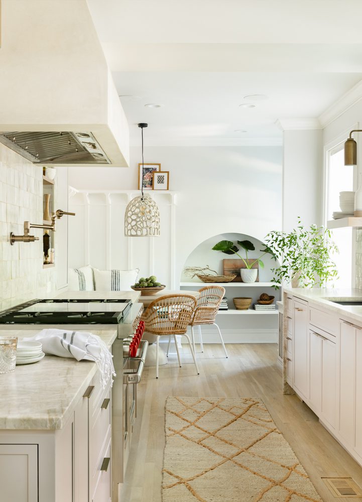 a kitchen with a neutral color scheme and natural accents