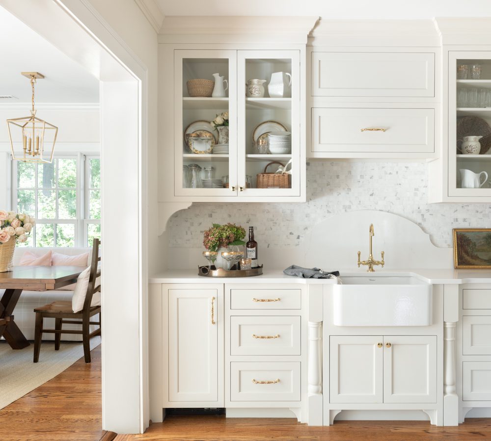 a bright white kitchen with organizational cabinetry