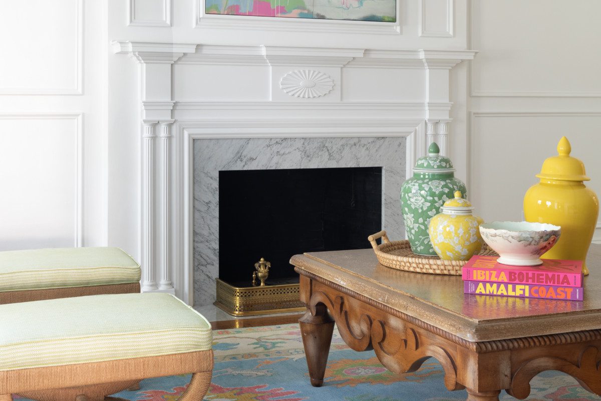 bright white fireplace with colorful decor