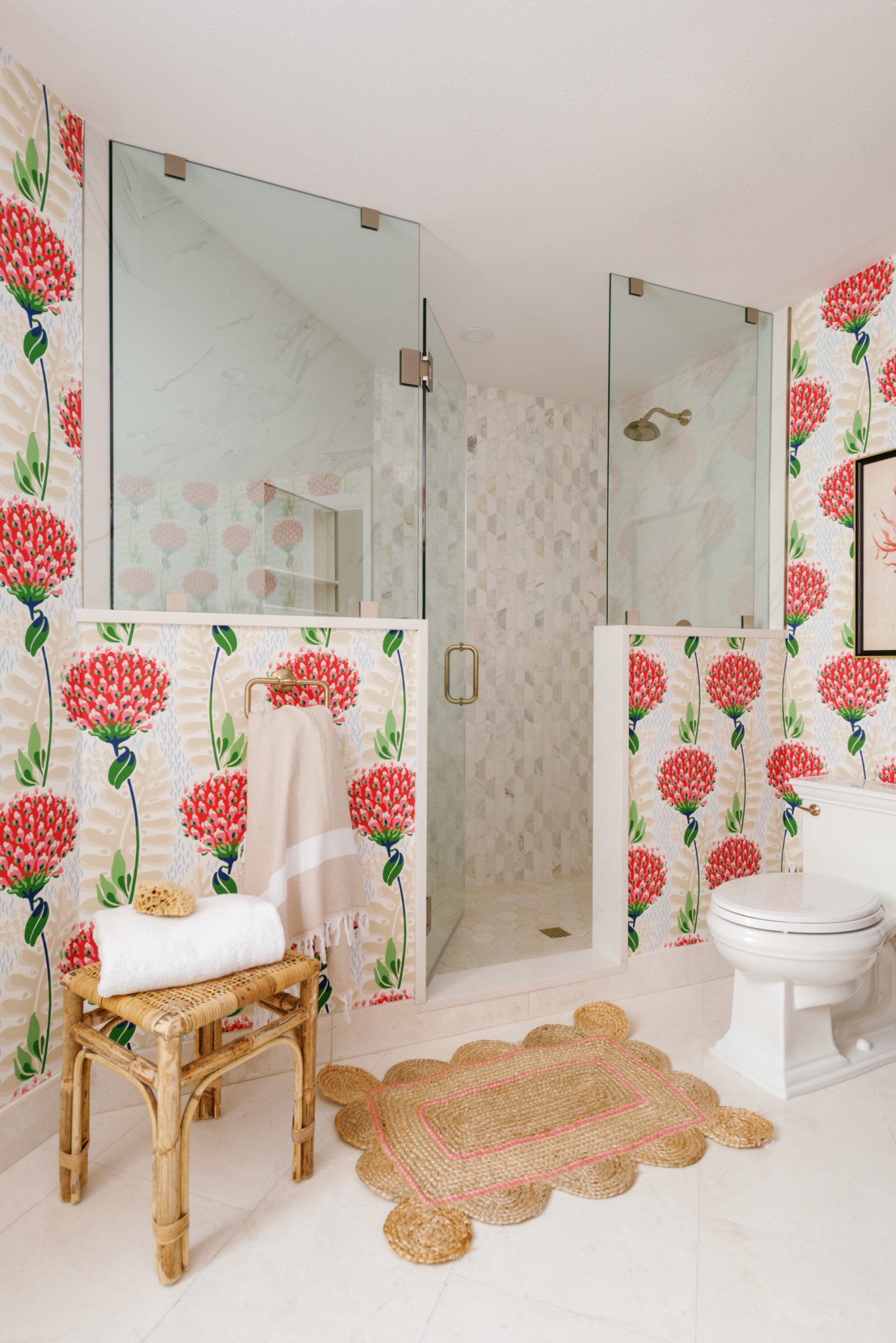 a large bathroom with bright floral wallpaper