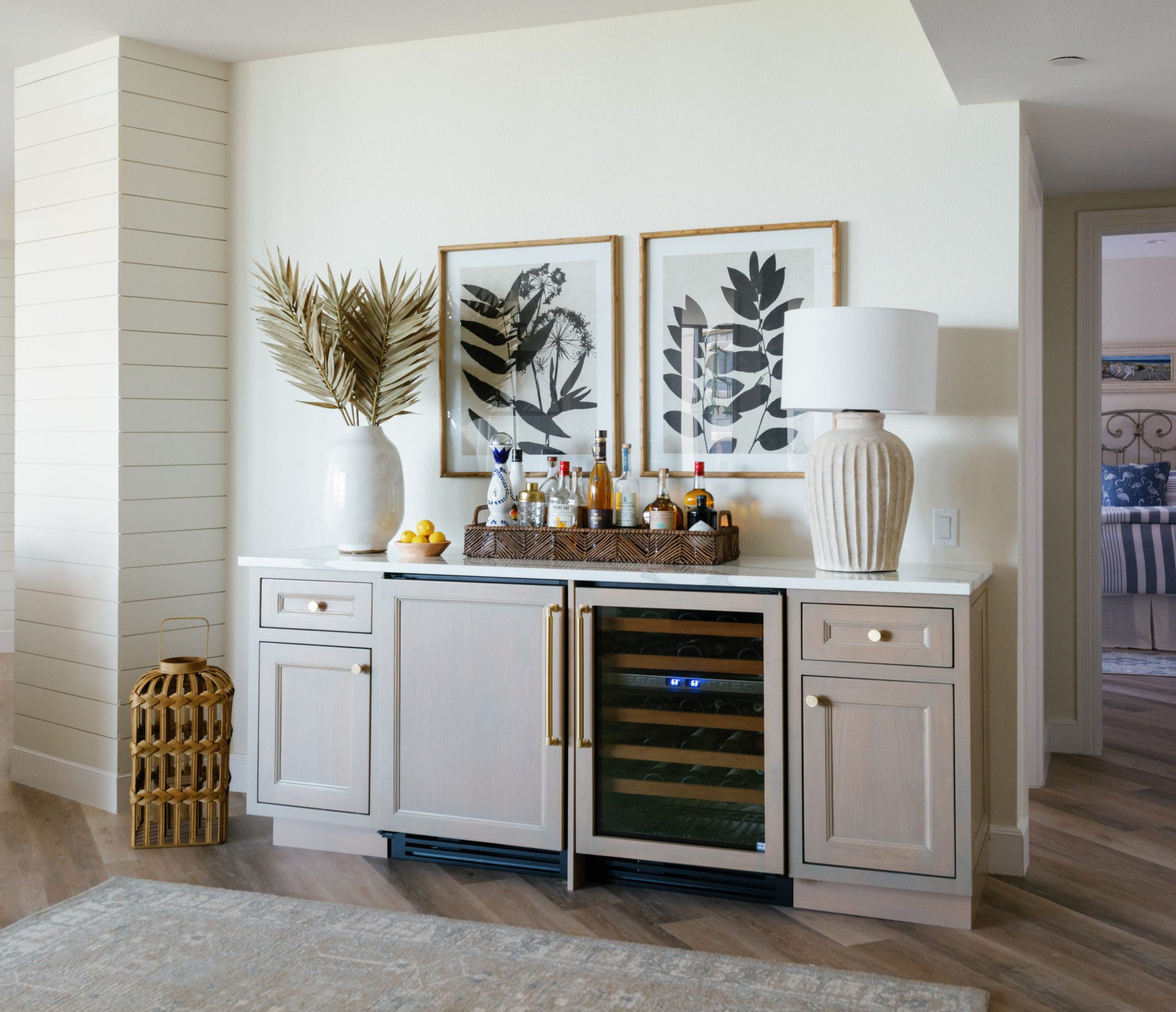 a mini bar in a bright room with natural accents