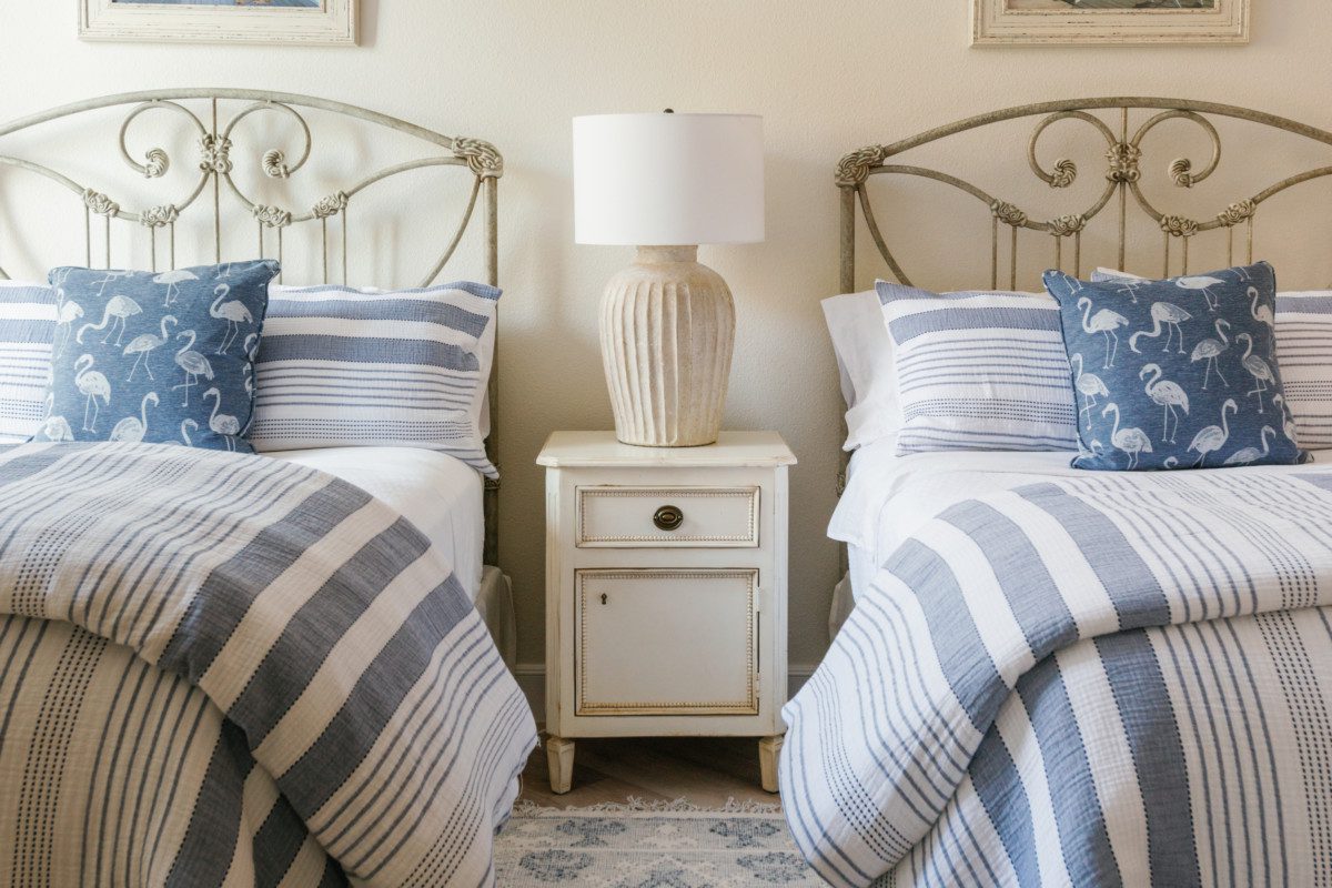 a coastal bedroom with twin beds
