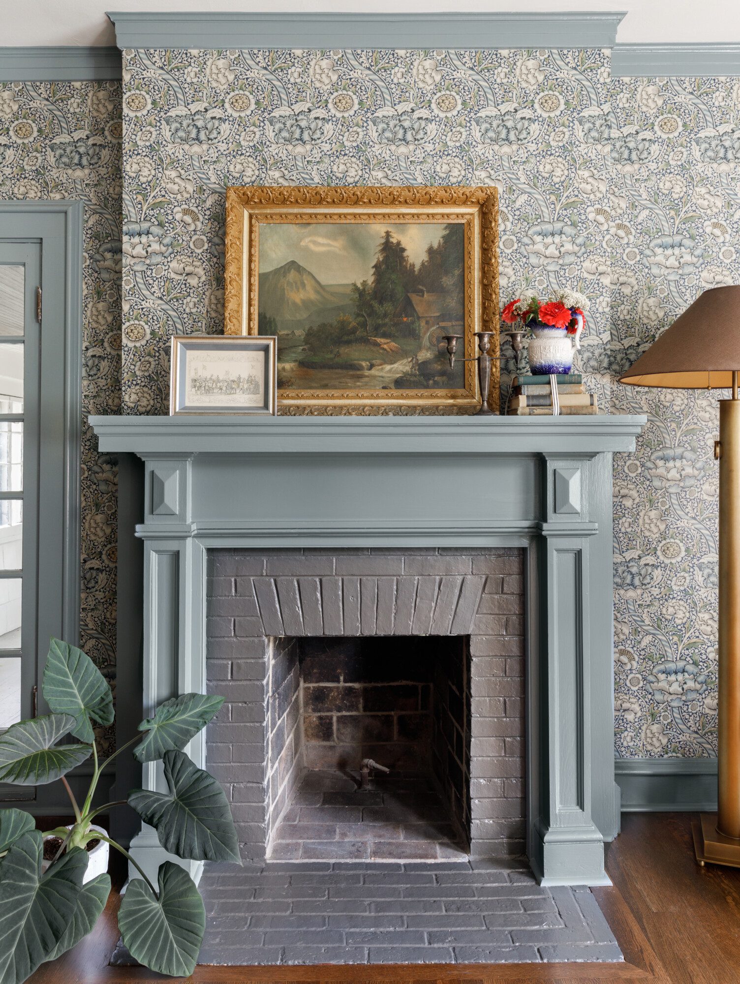 blue gray mantle on an ornate wallpapered wall