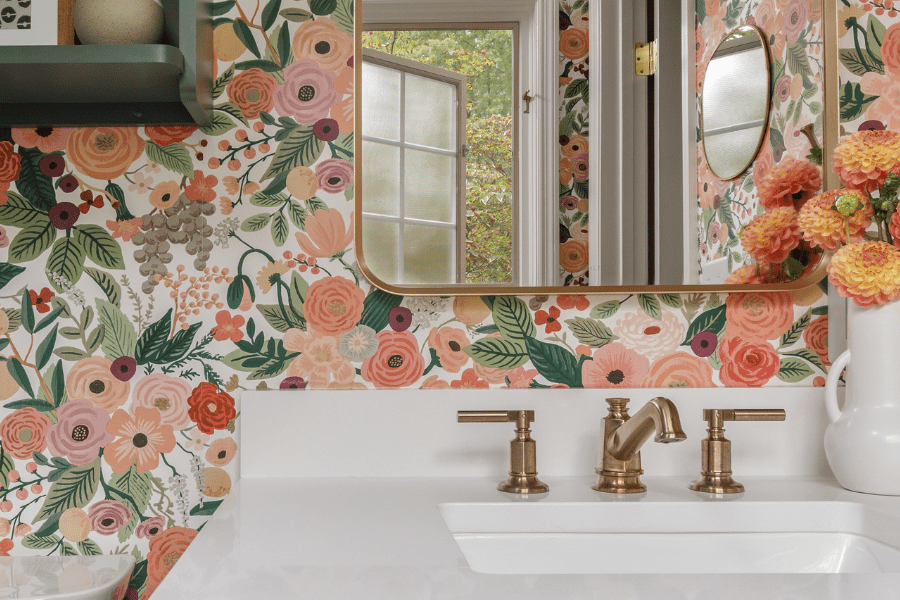 Bathroom with gold accents and flower pattern wallpaper