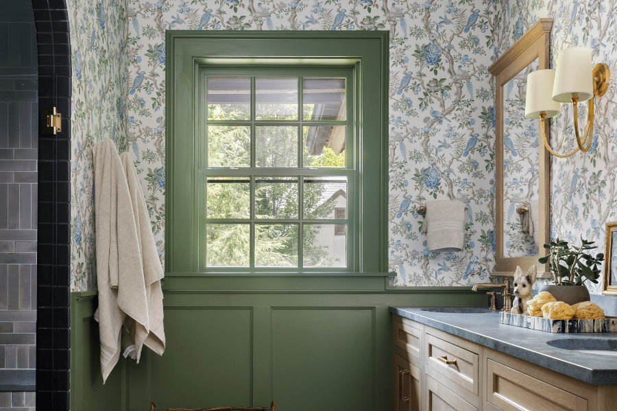 Green window with bird patterned wallpaper