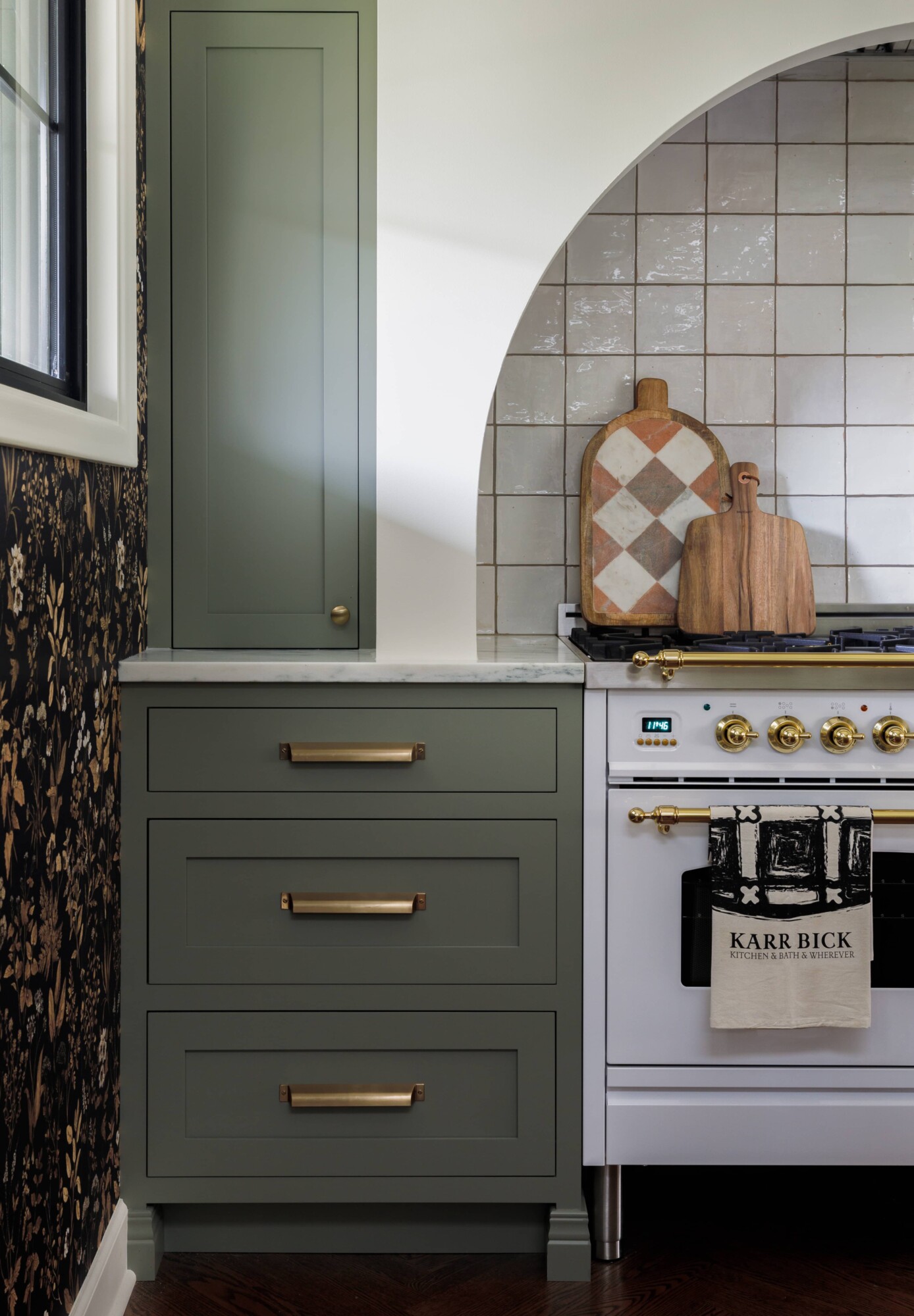 Honey Dew Kitchen Cabinets with gold hardware bring in a cozy feeling