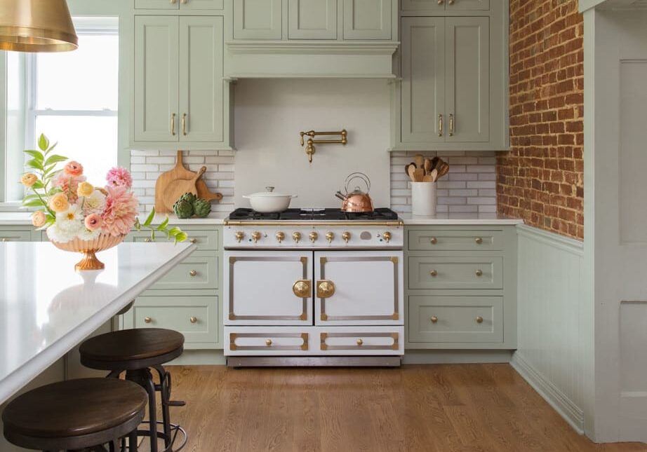 Hwy-KK-_213_201023-Edit bright kitchen with light green cabinetry and gold fixtures