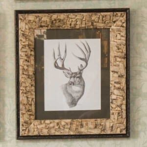 Jenny-Home-design-element-1 close up of a rustic frame with a sketched deer inside
