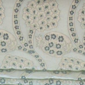close up of blue and white floral fabric on upholstery
