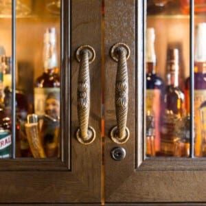 bar-remodel-historic-home-renovation-rausch-afters-element-1 close-up of decorative door handles.
