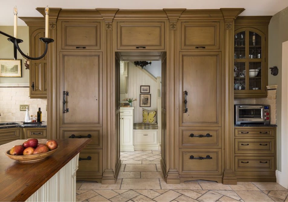 This historic home is the ultimate renovation. The open kitchen is perfect for gatherings and masterpieces that the kids wipe up. Details such as the distressed cabinetry, the ripple design wrapped around the island, and the hanging chandelier make the space #NothingOrdinary.