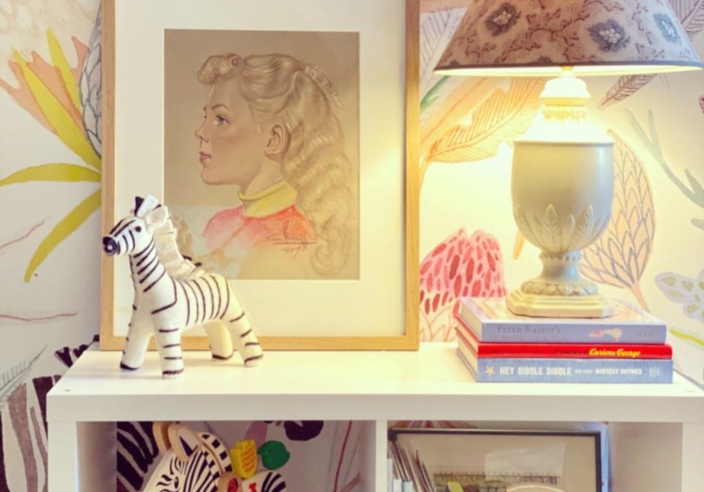 Watercolored jungle and animal scenes are a great way to complete the look of a child's bedroom along with a small bookshelf for toys and clothes.